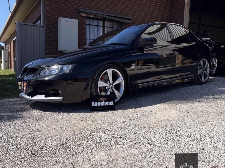 Black Holden Commodore front after paint correction