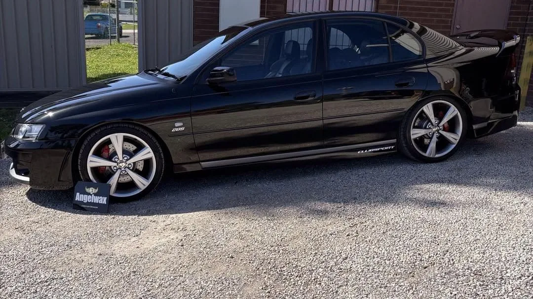 Side profile of a black Holden Commodore after paint correction, DJM Detailing Bendigo