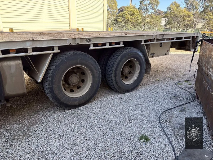 Flatbed truck wheels and tray before cleaning