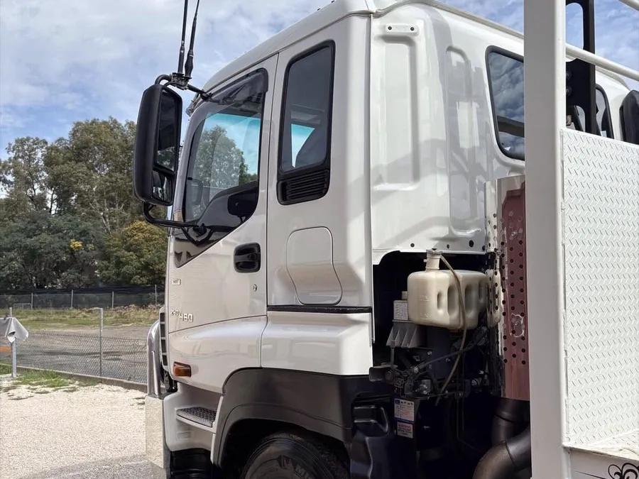 Dirty Isuzu truck cab before a detail