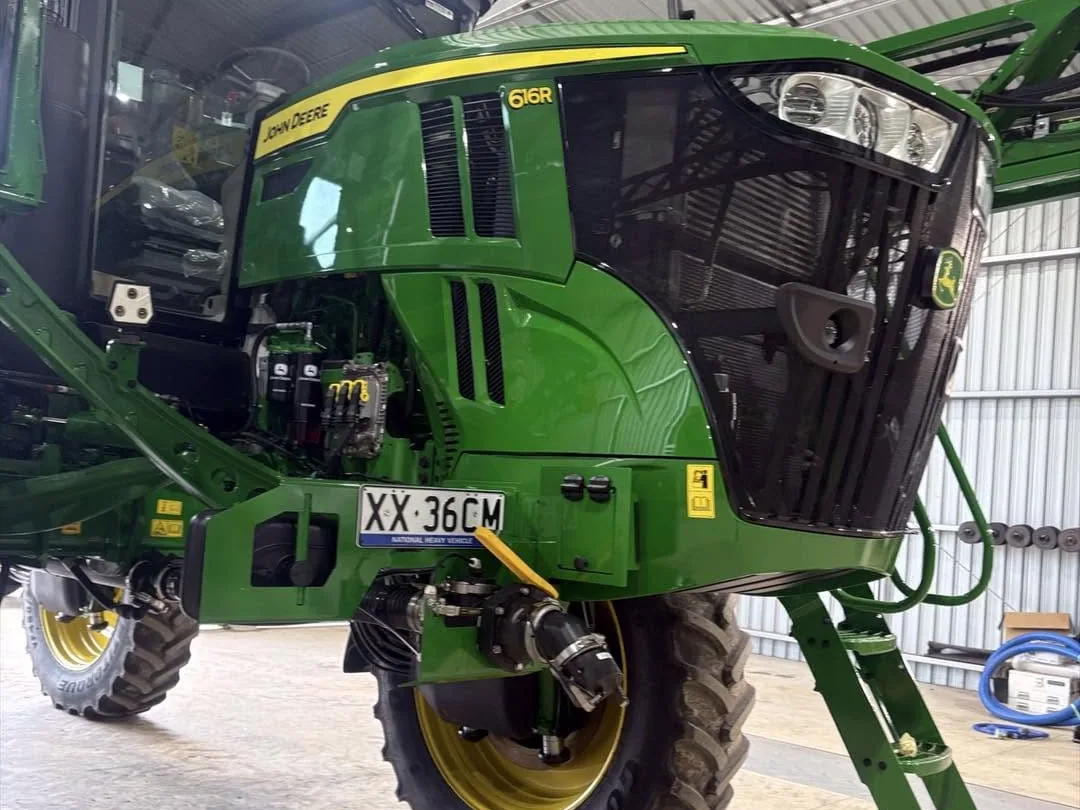 John Deere self-propelled sprayer detailed and polished inside a shed by DJM Detailing