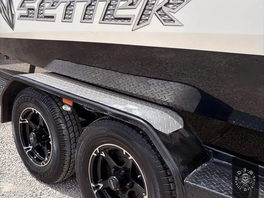 Polished Malibu Wakesetter hull and trailer wheels