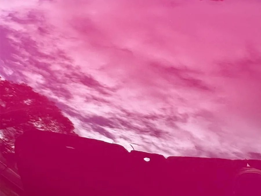 Sky reflected in a ceramic-coated pink bonnet