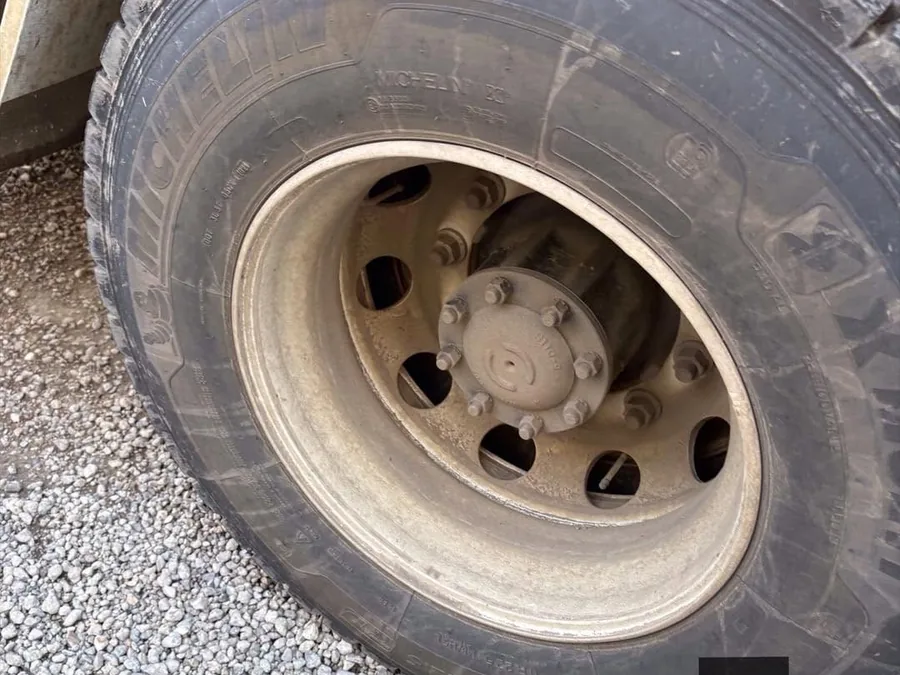Dirty truck wheel before cleaning